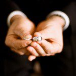 rings groom holding